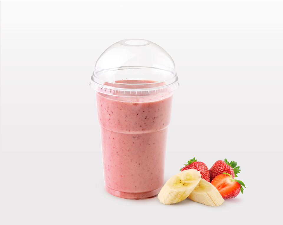 Banana, strawberry and chocolate milkshake in plastic cup with